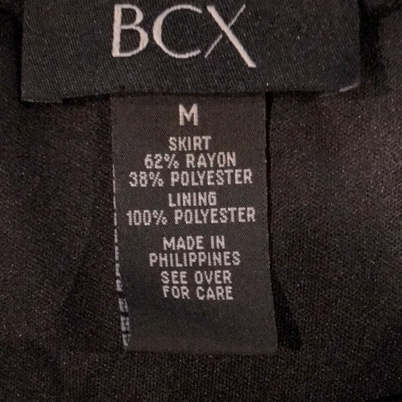 Black Skirt with High-Low Hemline and front slit with cascading ruffles. - Picture 13 of 14